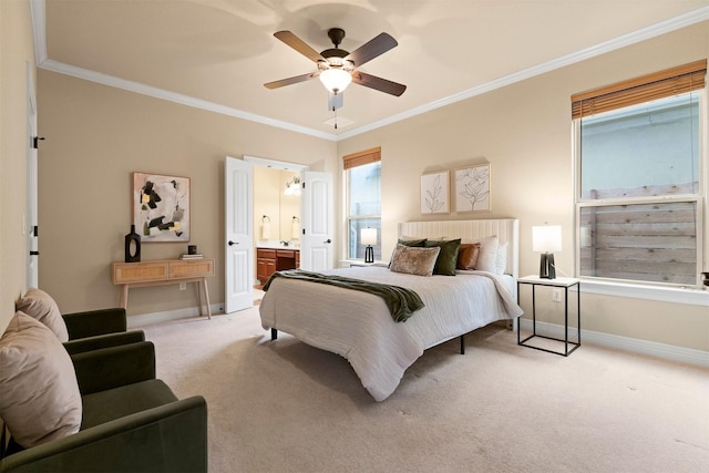 bedroom featuring ensuite bath, ornamental molding, light colored carpet, and ceiling fan