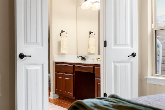 bathroom featuring tile patterned flooring, vanity, and a wealth of natural light