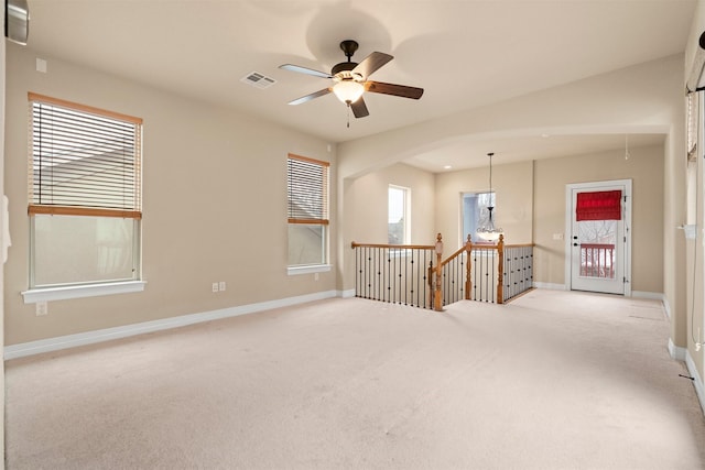 empty room with light carpet and ceiling fan