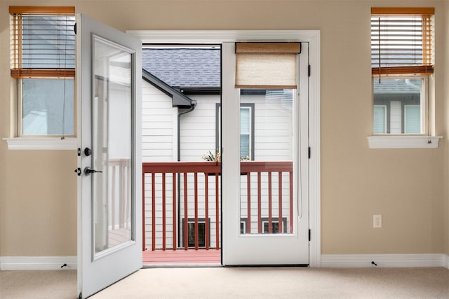 entryway with french doors and carpet floors