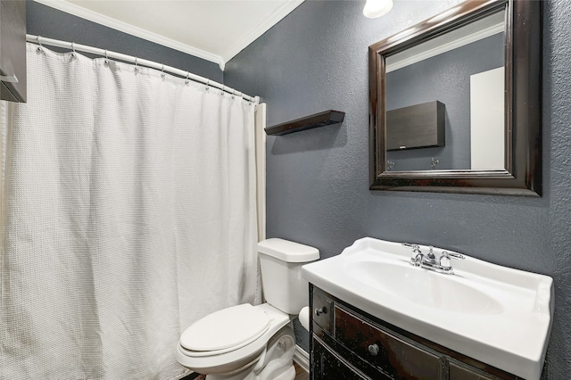 bathroom with vanity, toilet, and crown molding