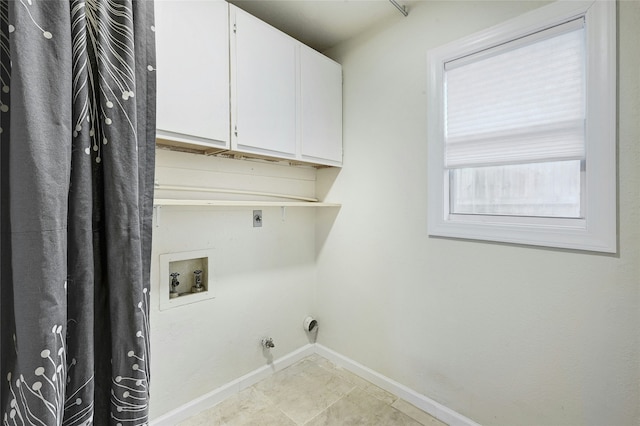 clothes washing area featuring cabinets, washer hookup, electric dryer hookup, and hookup for a gas dryer