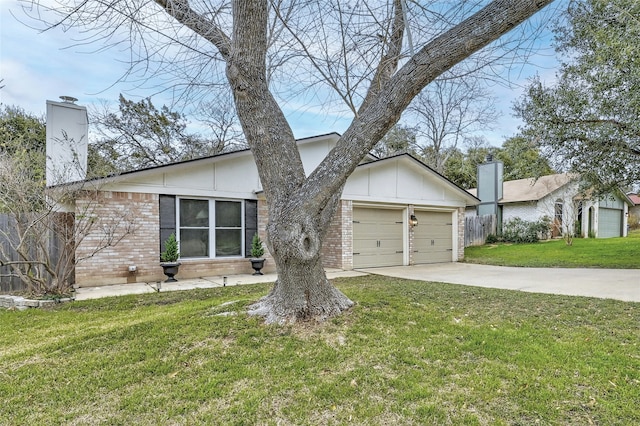 ranch-style home with a garage and a front lawn