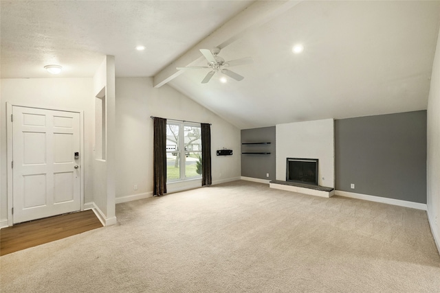 unfurnished living room featuring light carpet, lofted ceiling with beams, and ceiling fan