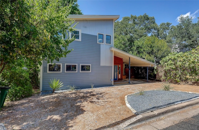 contemporary house with a carport