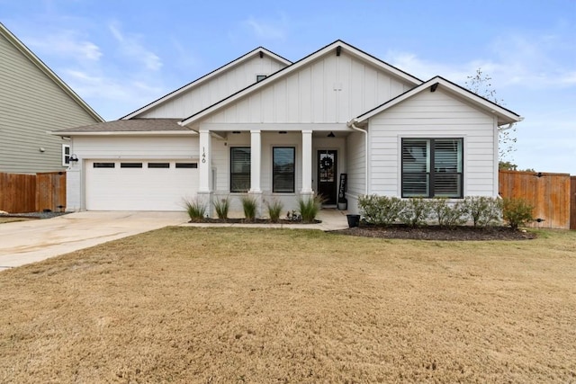 view of front of home featuring a garage and a front lawn