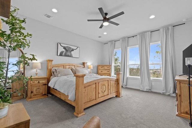 bedroom with ceiling fan, recessed lighting, visible vents, and light colored carpet