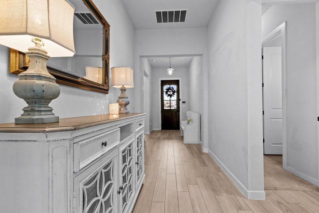 foyer with light hardwood / wood-style flooring