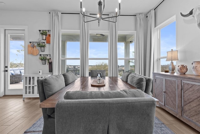 dining space with hardwood / wood-style flooring and a wealth of natural light