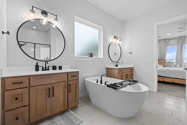 bathroom with independent shower and bath, tile patterned floors, and vanity