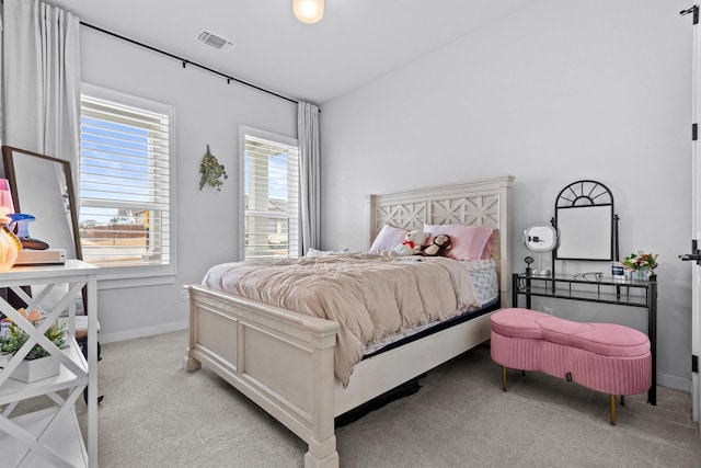 bedroom with light colored carpet