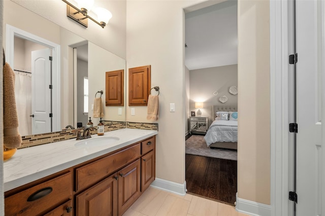 bathroom with vanity and backsplash