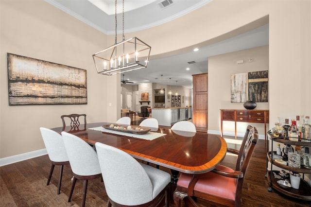 dining area featuring dark hardwood / wood-style floors and ornamental molding