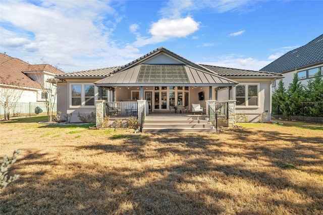 916 Morning Moon Cir, Austin, TX 78732 - rear view of property with stucco siding and a tiled roof