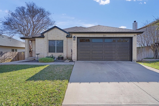 view of front of property featuring a front yard and a garage