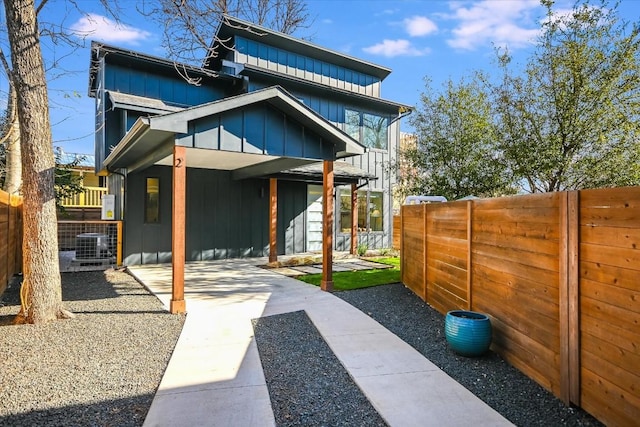 612 Irma Dr Unit 2, Austin, TX 78752 - rear view of property with board and batten siding