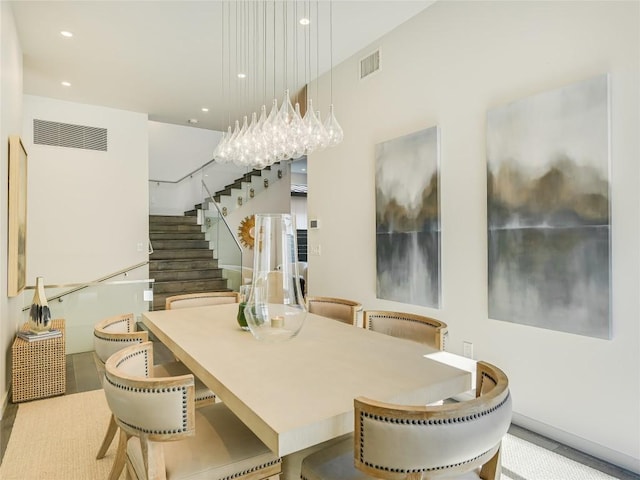 dining space featuring recessed lighting, visible vents, and stairway