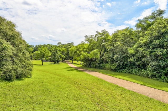 surrounding community featuring a lawn