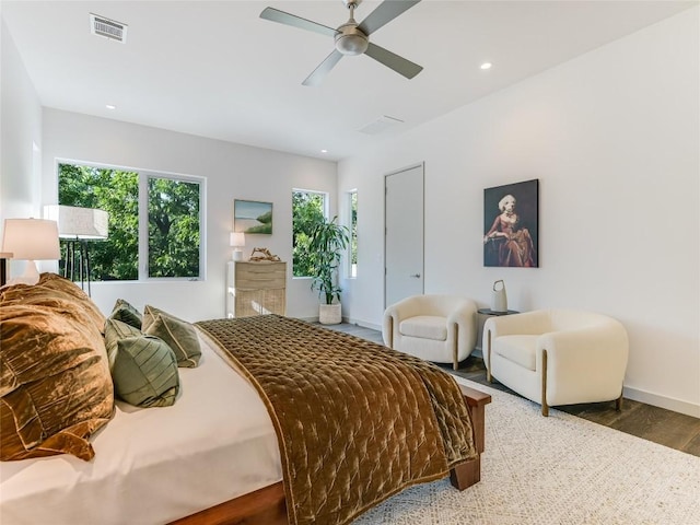 bedroom featuring recessed lighting, wood finished floors, a ceiling fan, baseboards, and visible vents