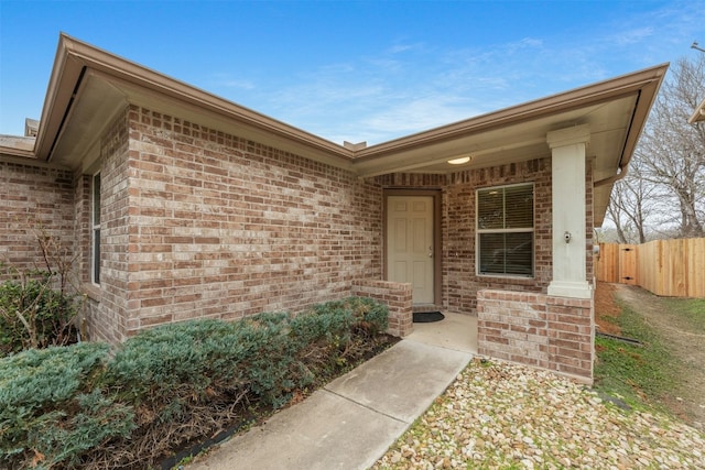 12206 Athens St, Manor, TX 78653 - doorway to property with brick siding