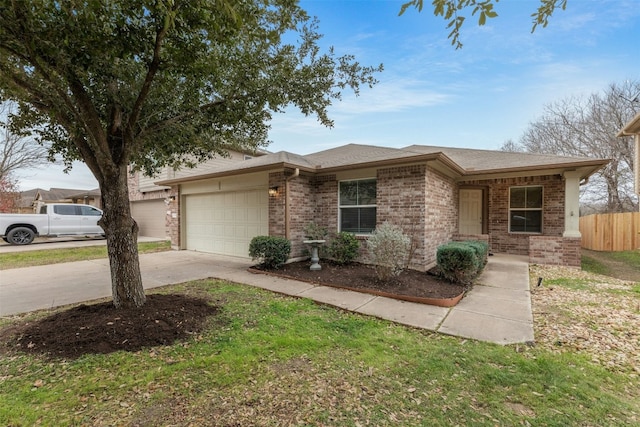 12206 Athens St, Manor, TX 78653 - view of front facade with brick siding, a garage, concrete driveway, and roof with shingles