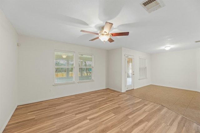 12206 Athens St, Manor, TX 78653 - empty room featuring a ceiling fan, light wood finished floors, and baseboards
