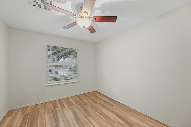 spare room featuring ceiling fan and light hardwood / wood-style flooring