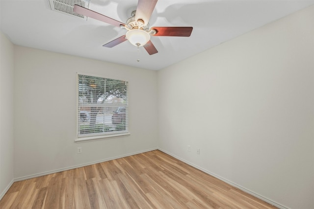 12206 Athens St, Manor, TX 78653 - empty room with wood finished floors, a ceiling fan, and baseboards