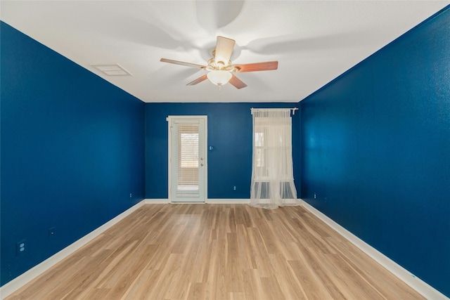 12206 Athens St, Manor, TX 78653 - spare room featuring a ceiling fan, wood finished floors, and baseboards