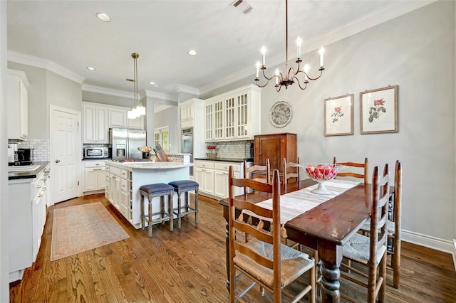 dining area featuring wood-type flooring and ornamental molding