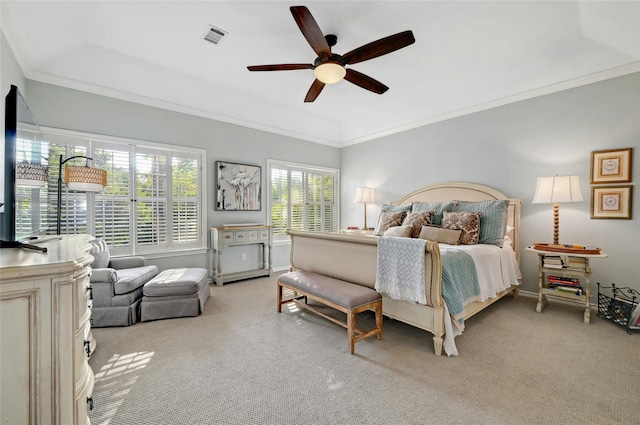 carpeted bedroom featuring ceiling fan and ornamental molding