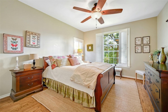 bedroom featuring light wood-type flooring and ceiling fan