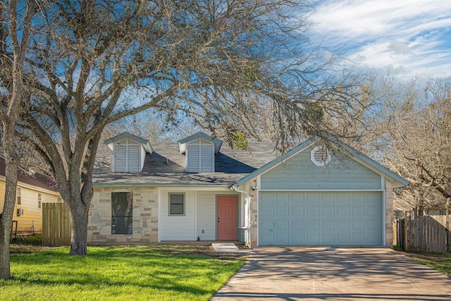 106 N Mockingbird Cir, Cedar Creek, TX 78612 - view of front facade with driveway, a garage, and stone siding