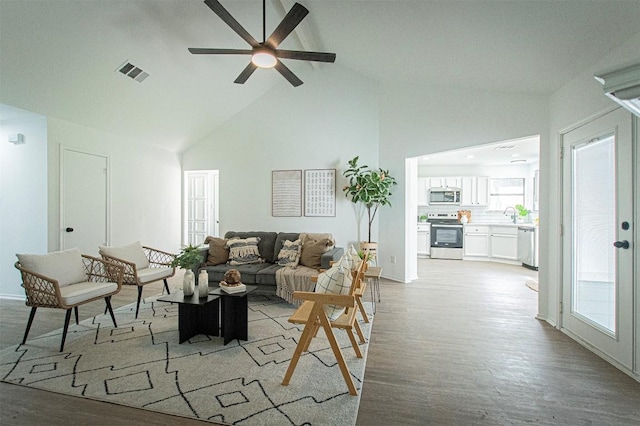 106 N Mockingbird Cir, Cedar Creek, TX 78612 - living room with a ceiling fan, light wood-type flooring, and high vaulted ceiling
