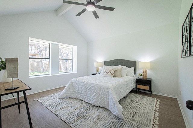 bedroom with ceiling fan, lofted ceiling with beams, and hardwood / wood-style flooring