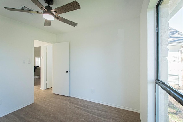 106 N Mockingbird Cir, Cedar Creek, TX 78612 - unfurnished room featuring wood finished floors and a ceiling fan