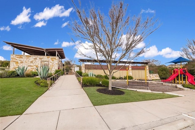 exterior space with a playground and a front yard