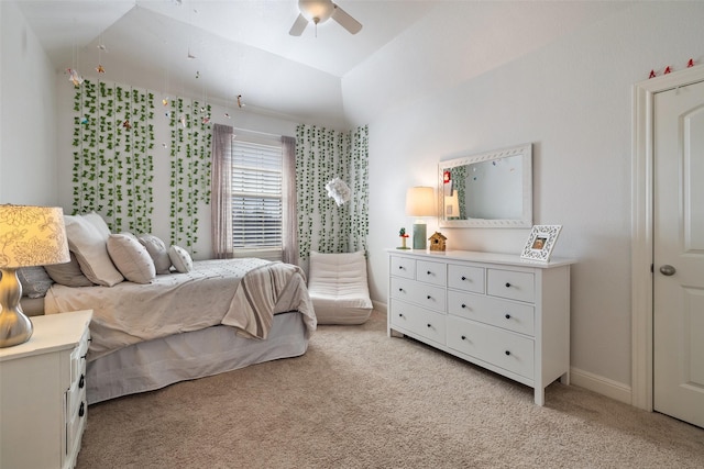 bedroom with lofted ceiling, light colored carpet, and ceiling fan