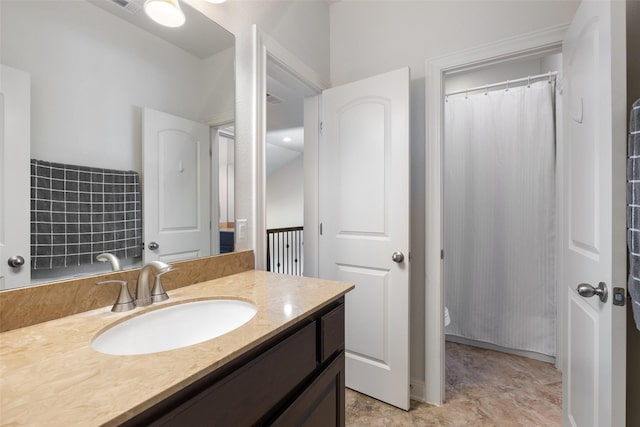 bathroom featuring vanity and walk in shower