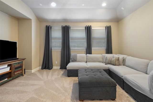 living room with lofted ceiling and light carpet