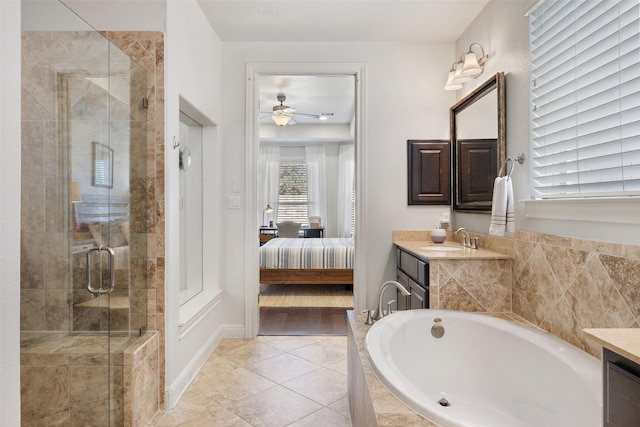 bathroom with tile patterned floors, separate shower and tub, ceiling fan, and vanity