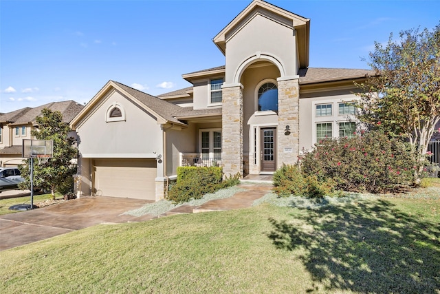 view of front facade with a front lawn and a garage