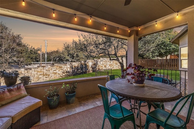 view of patio terrace at dusk