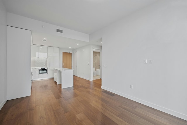 unfurnished living room featuring light hardwood / wood-style flooring