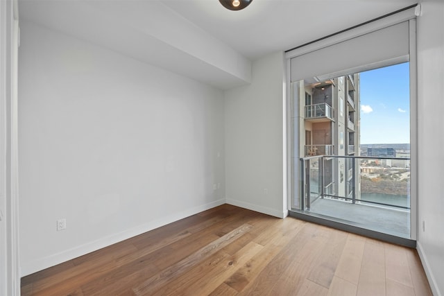 unfurnished room featuring light hardwood / wood-style floors