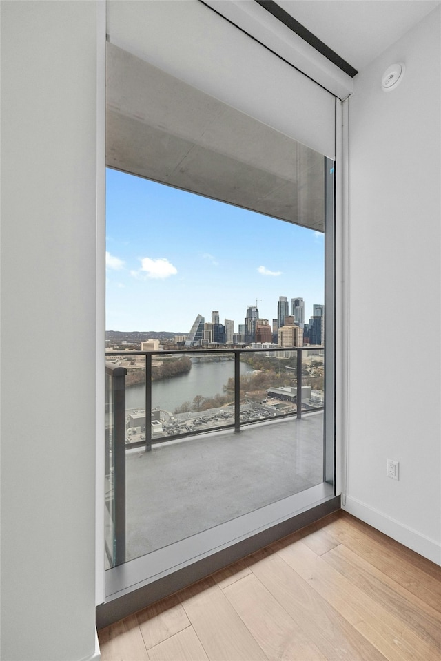 interior space featuring a water view and light wood-type flooring