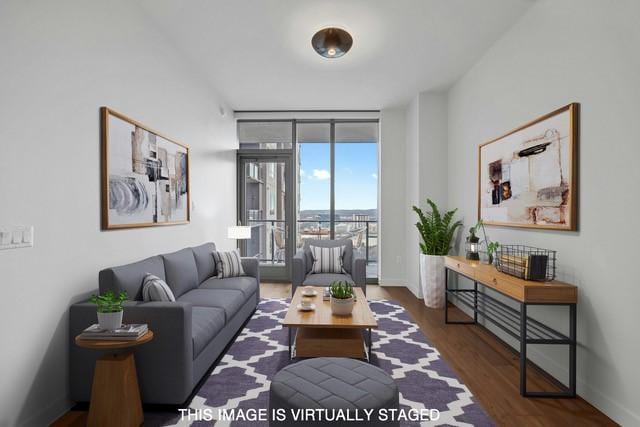 living room with a wall of windows and dark hardwood / wood-style floors