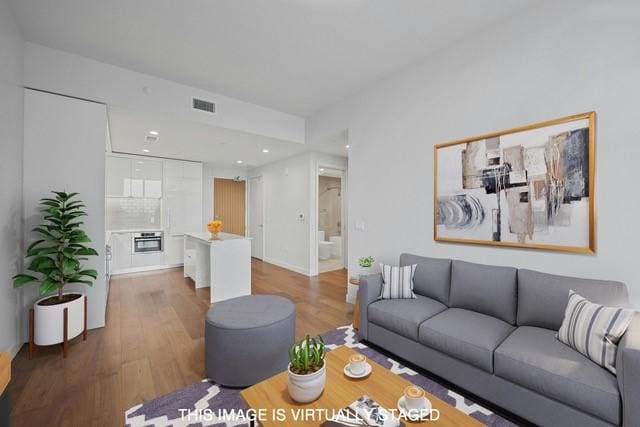 living room featuring dark wood-type flooring