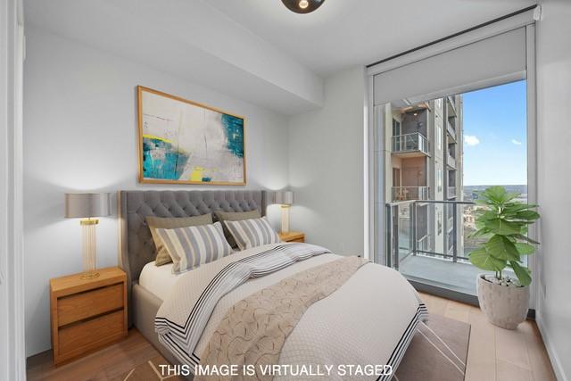 bedroom with access to exterior and light wood-type flooring