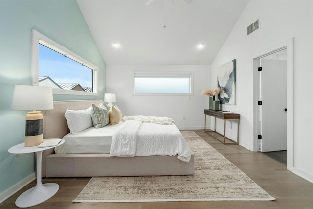 bedroom with high vaulted ceiling and hardwood / wood-style flooring